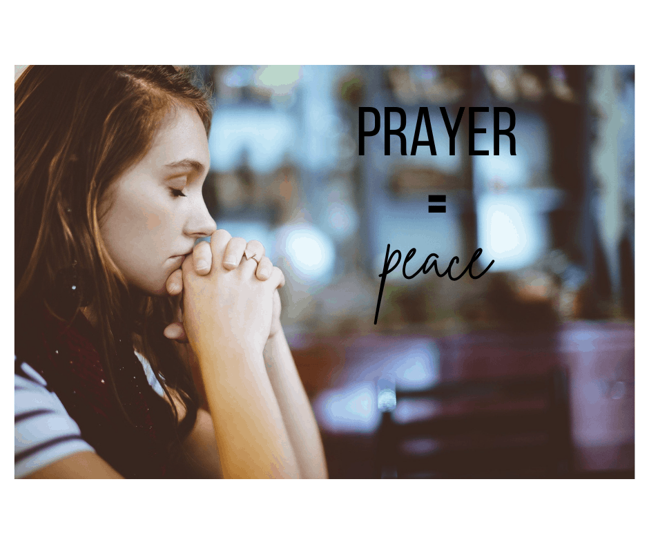 Woman praying with face resting on folded hands with text prayer equal sign peace.
