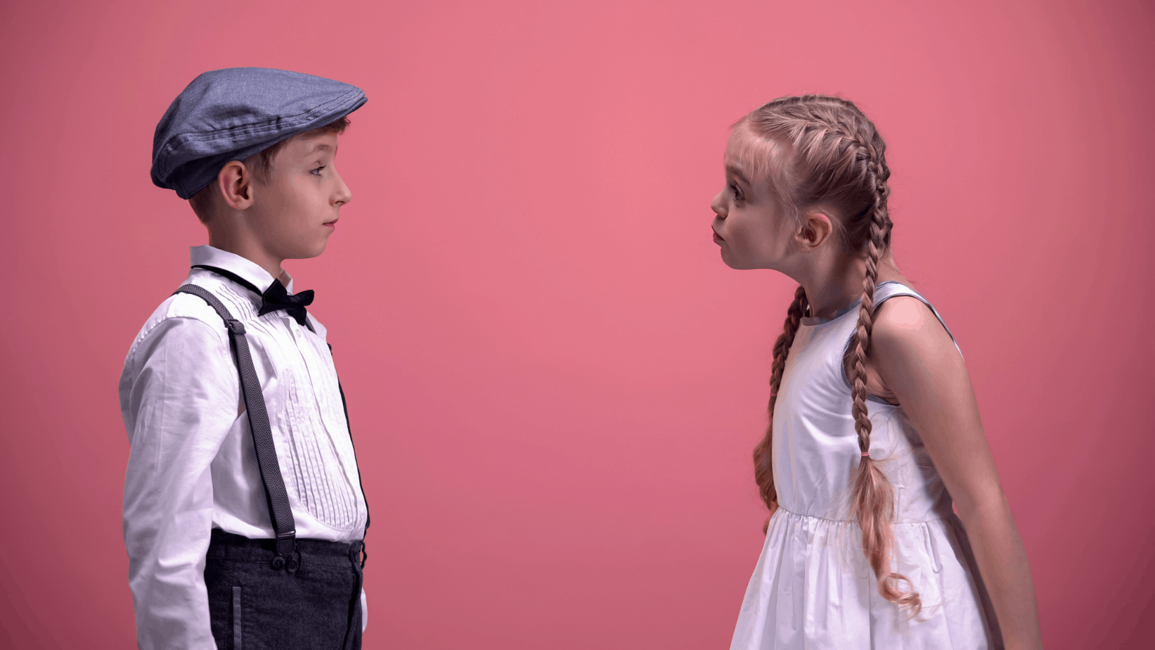 Image of a young boy and a young girl discussing something serious.