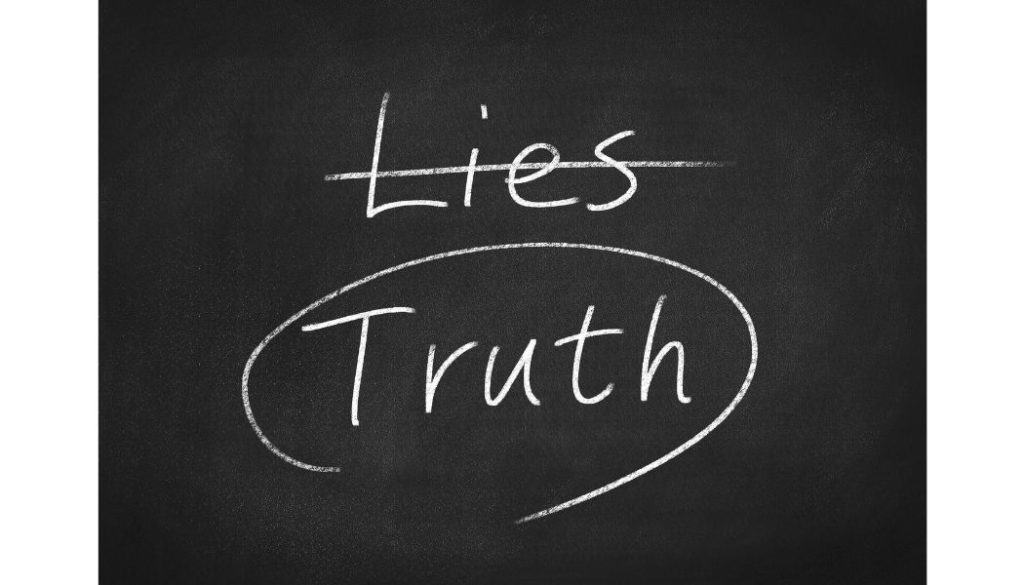 Blackboard showing the word "lies" crossed out and the word "truth" circled.