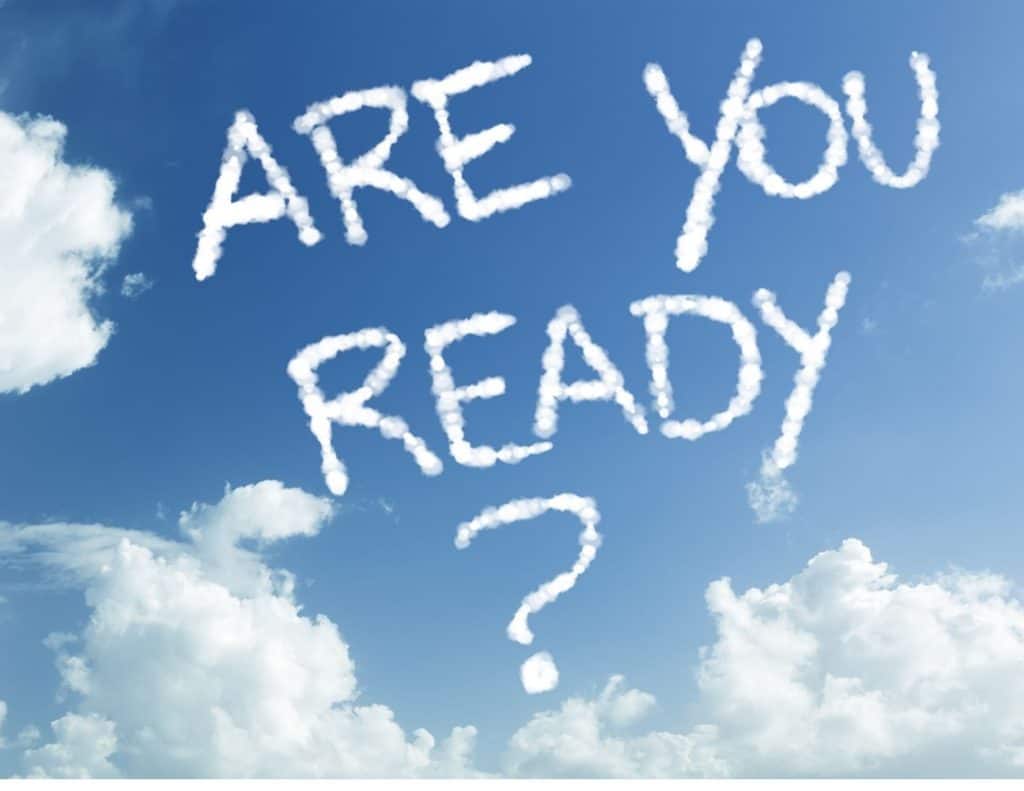 Image of blue sky with white clouds and wispy clouds that spell out "Are you ready?"
