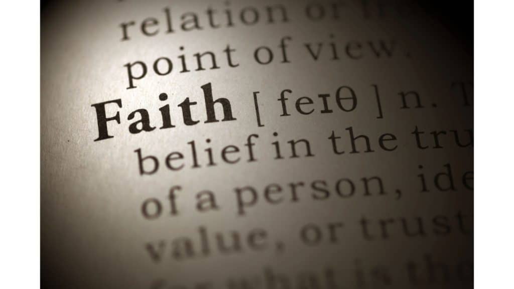 Close-up of the word "faith" in the dictionary.