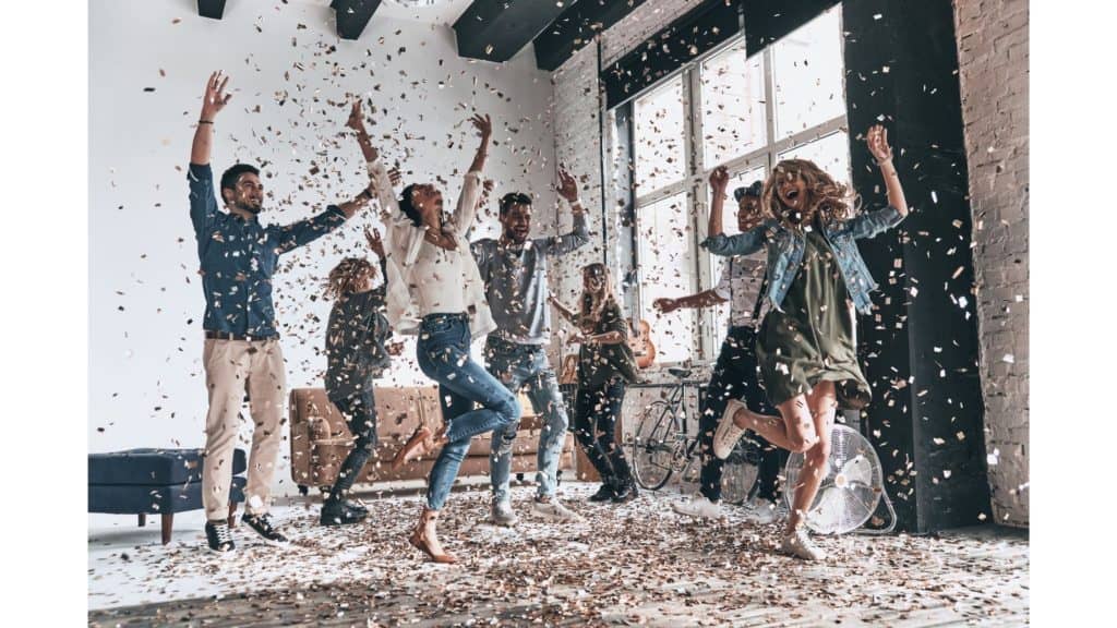 Happy people dancing around in a shower of confetti, probably celebrating because one of them just got saved. ;)