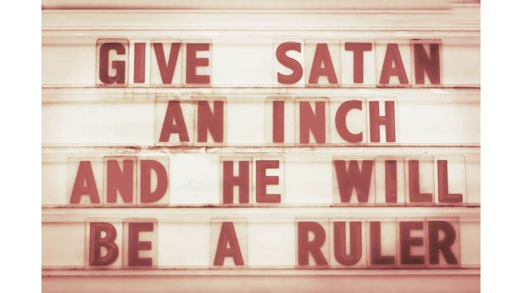 Letter board with the message "Give Satan and inch and he will be a ruler."