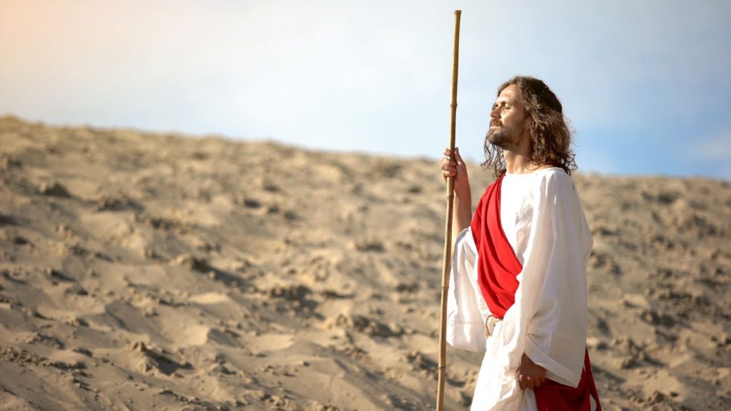 Image of Jesus standing in the desert.