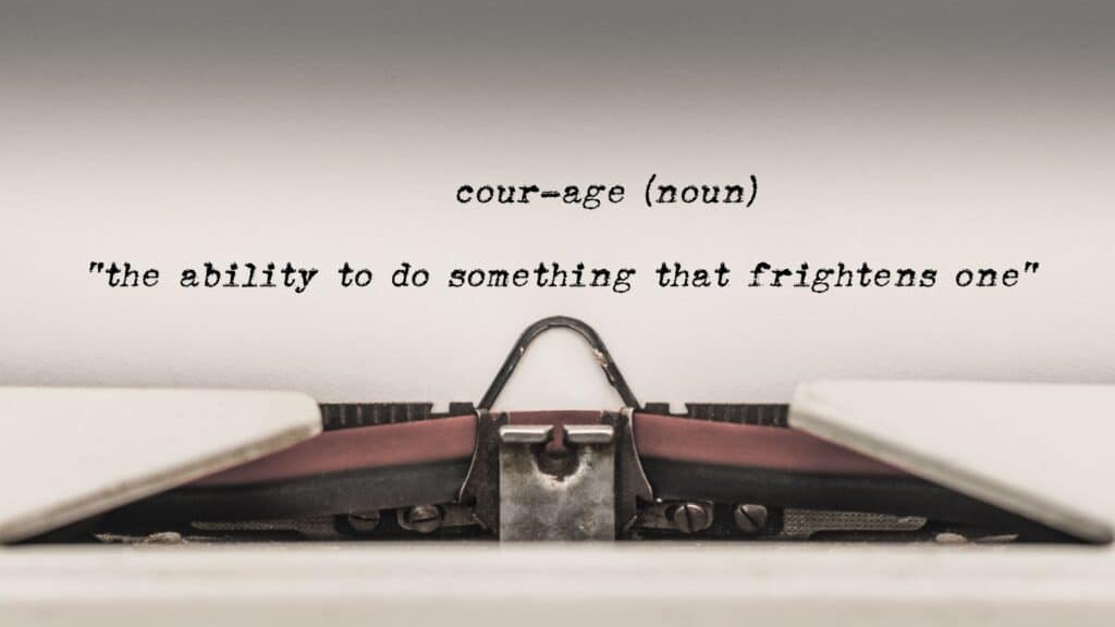 "Courage (noun) - The ability to do something that frightens one." typed out on a typewriter.